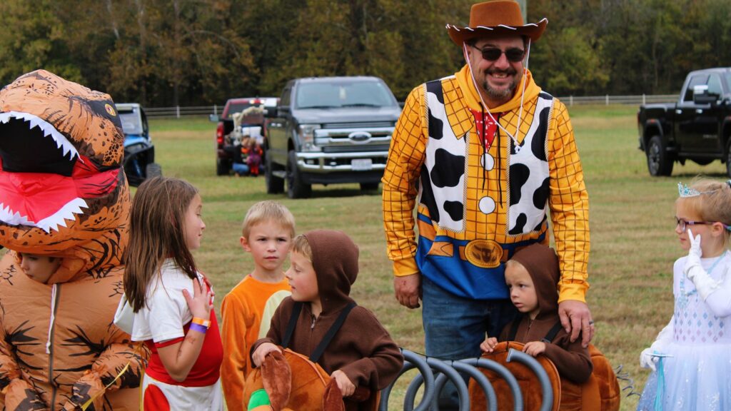Children in the costume contest, one dressed as Woody