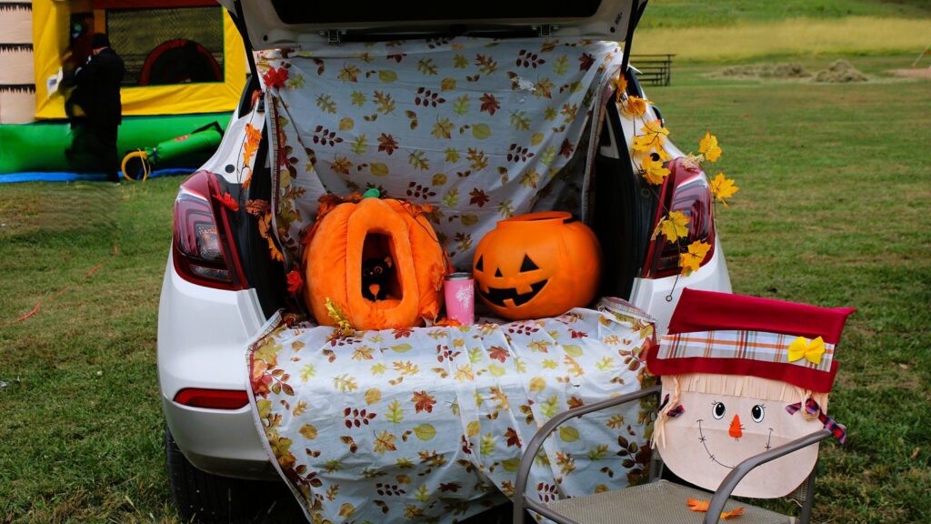 A decorated car handing out sweets at trunk-or-treat