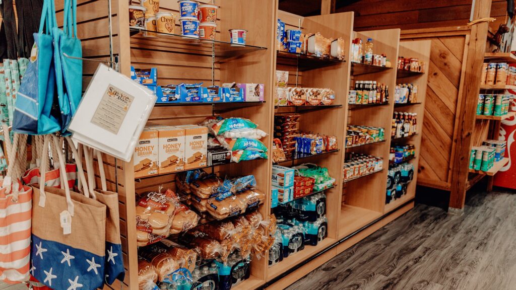 Shelves of groceries, snacks and camping supplies in the camp store.