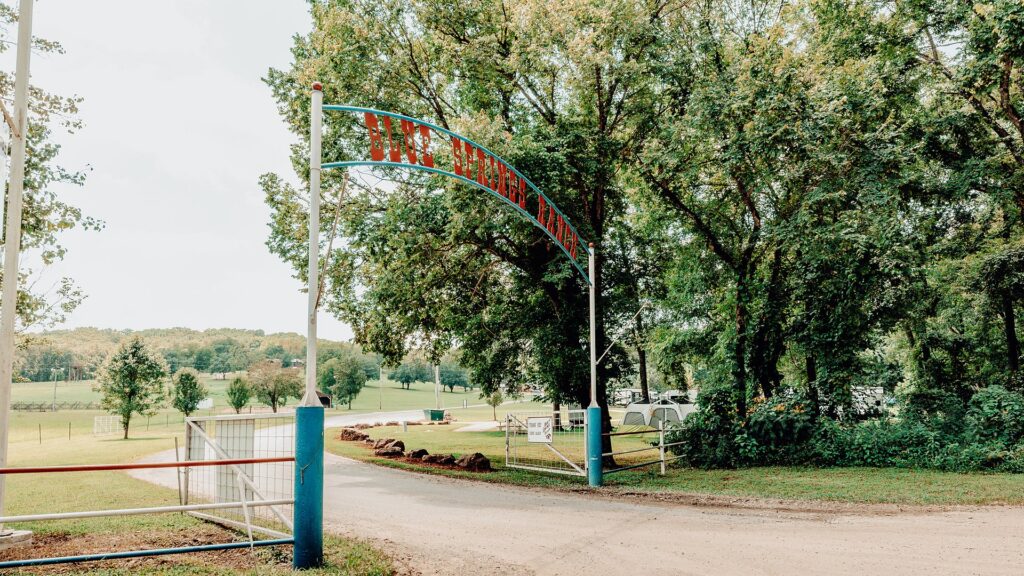 The Blue Springs Ranch entrance arch over the drive into the resort.