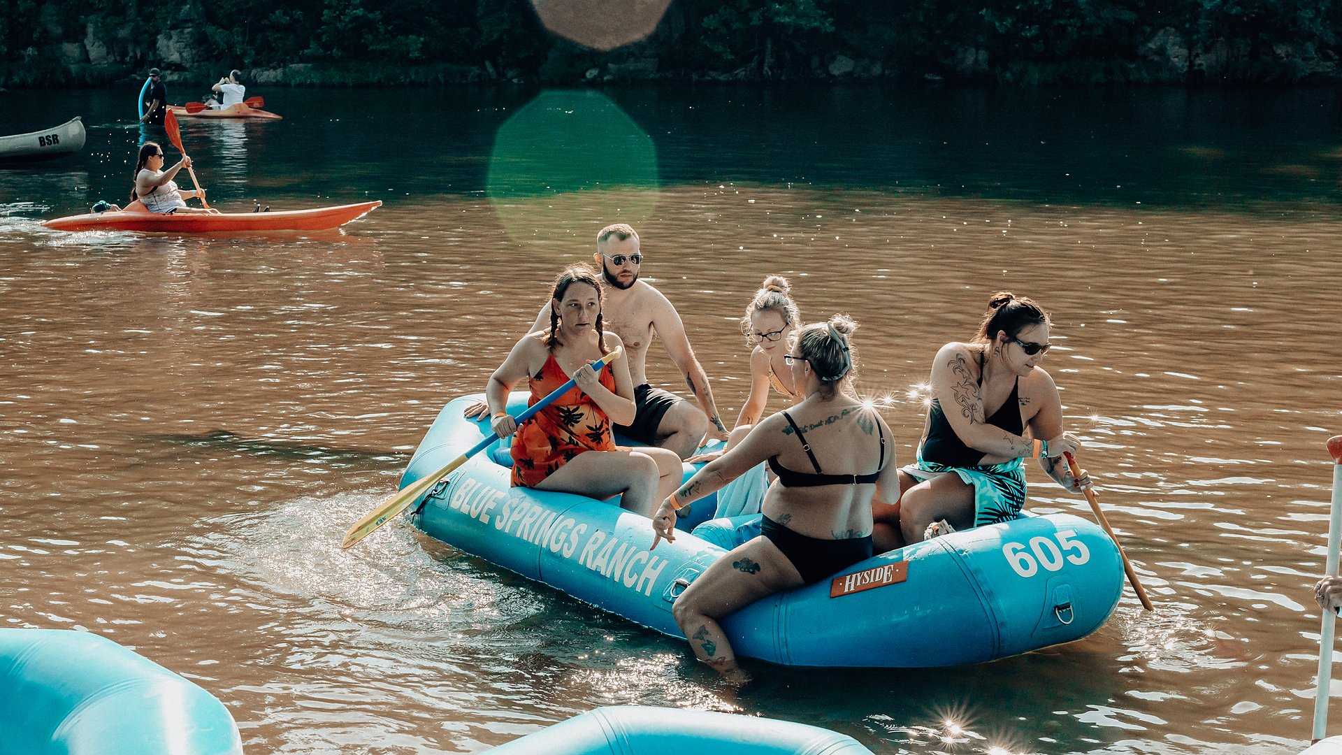 Five guests paddling a Blue Springs Ranch raft down the Meramec.