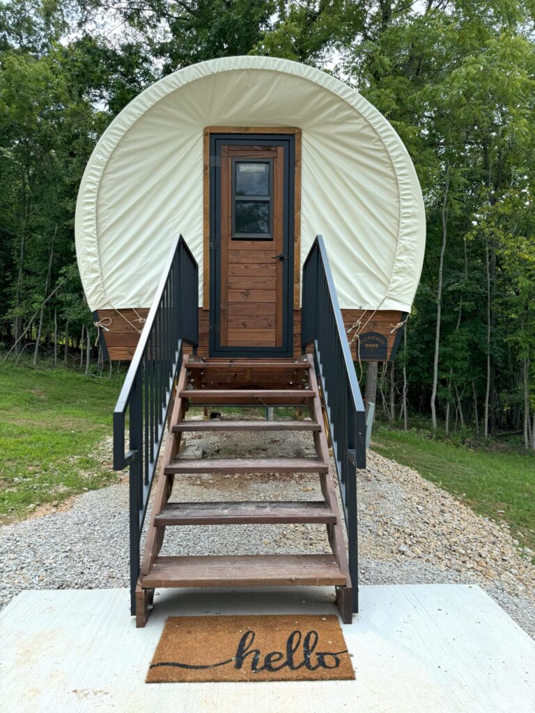 The King Conestoga Wagon, a canvas-topped wagon with its own deck and steps.