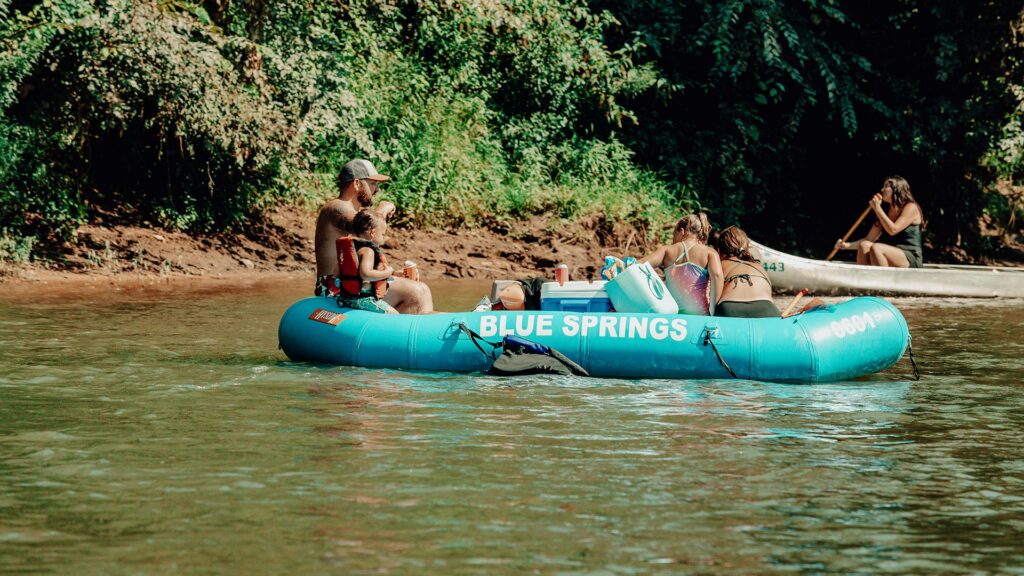 A large Blue Springs Ranch raft carrying a group downstream.