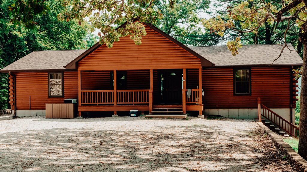 The log cabin lodge with its covered porch and ramp.