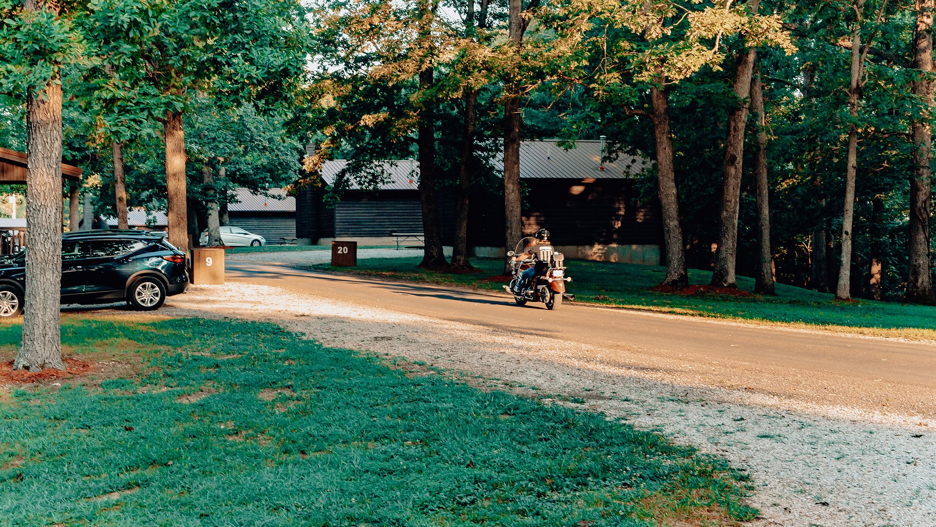 The resort road past the cabins in late afternoon light.