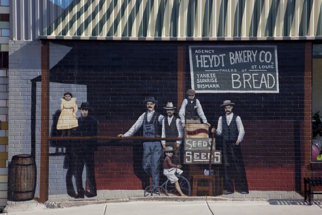 Route 66 mural in Cuba, Missouri, of shopkeepers outside the Heydt Bakery Co.