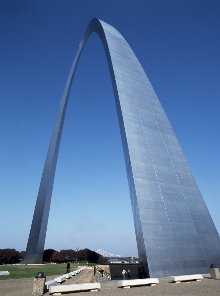 The Gateway Arch rising against a blue sky in St. Louis